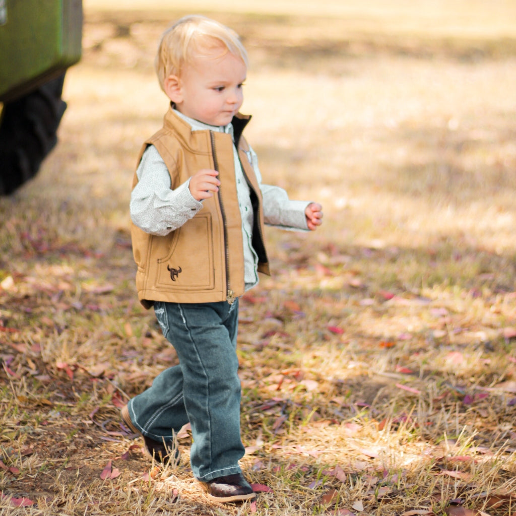 little cowboy wearing infant and toddler boy's western outerwear from Cowboy Hardware