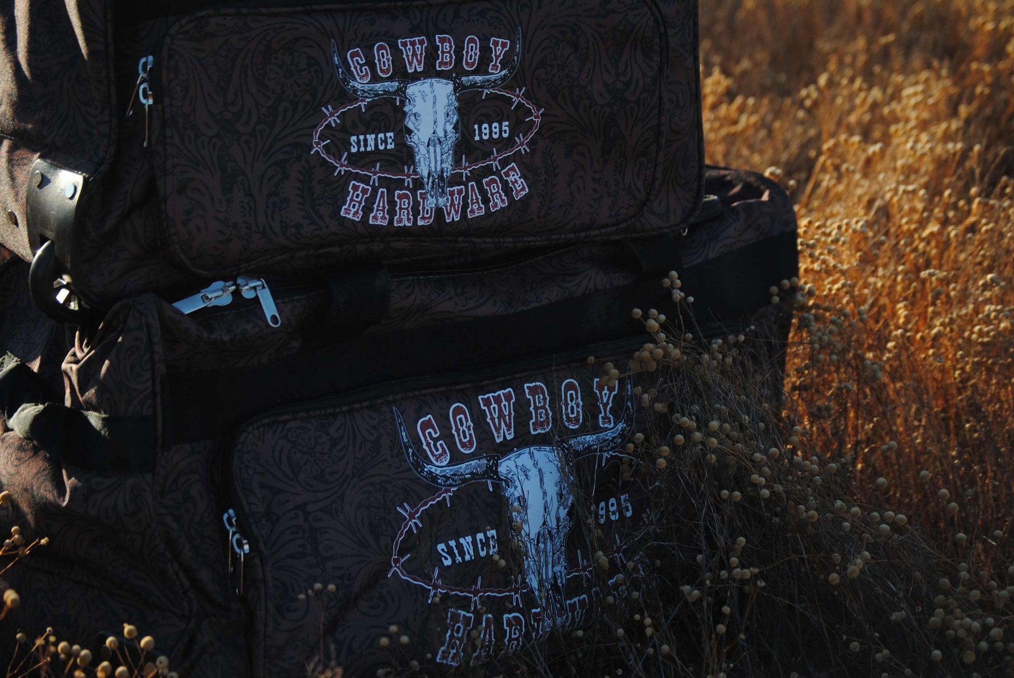 CH Outlaw Since 95' 3 Wheel Gear Bags in Field from Cowboy Hardware