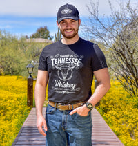 Cowboy wearing Tennessee Whiskey CH t-shirt on dock.