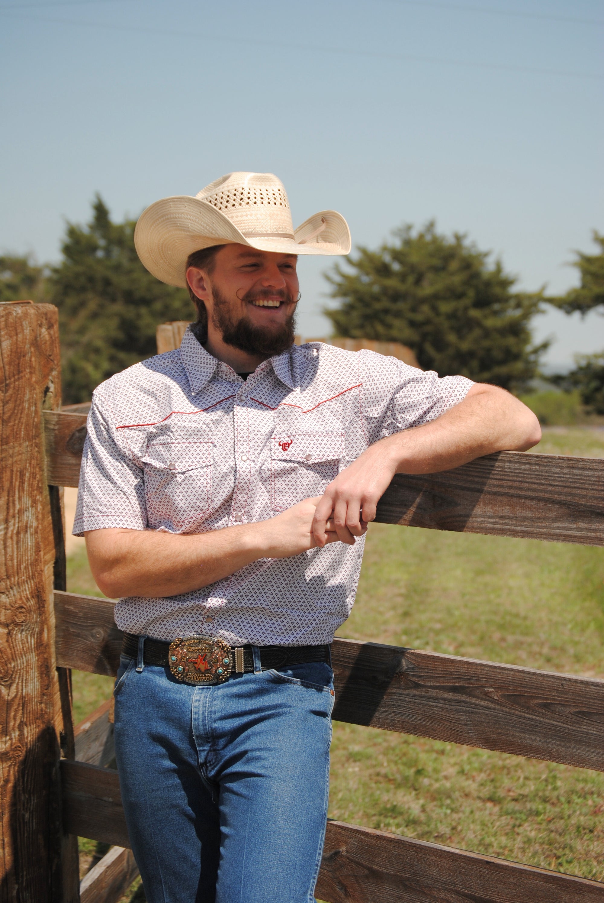 Cowboy wearing a "Fleur D' Cowboy" White Short Sleeve Western Shirt from Cowboy Hardware