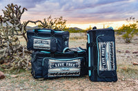 Cowgirl Hardware Live Free Serape Gear Bags Small, Medium, Large in Grey and Turquoise in a desert scene