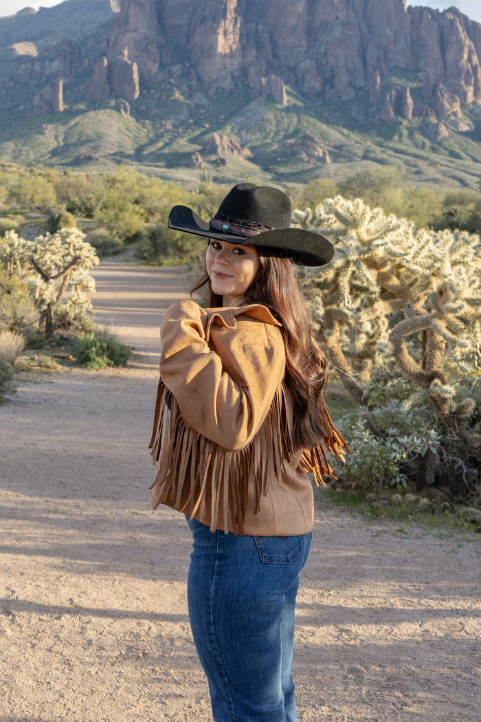 Cowgirl enjoying the mountains wearing her Faux Suede V Fringe Jacket.