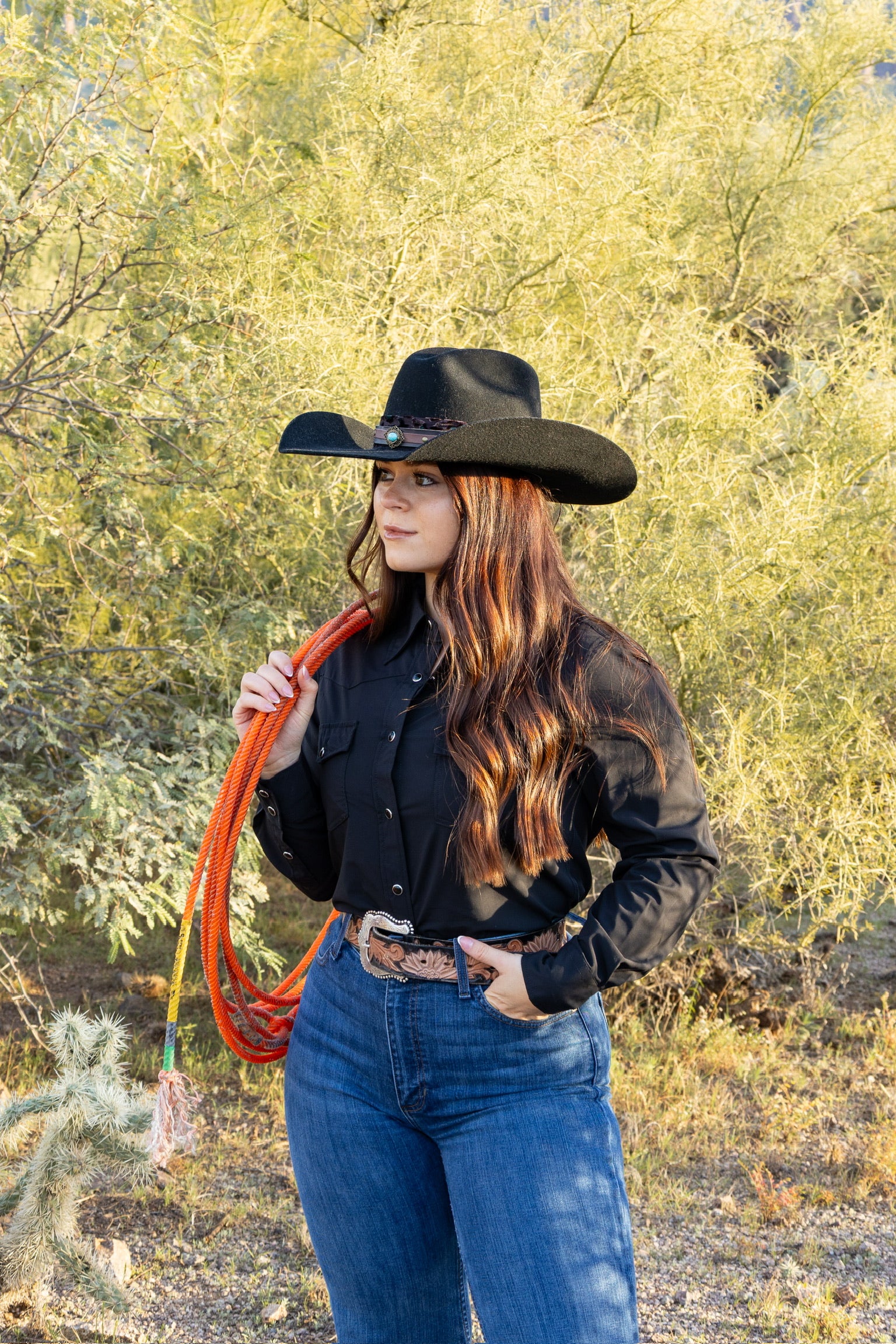 Cowgirl looking for her cattle to bring back to the ranch.