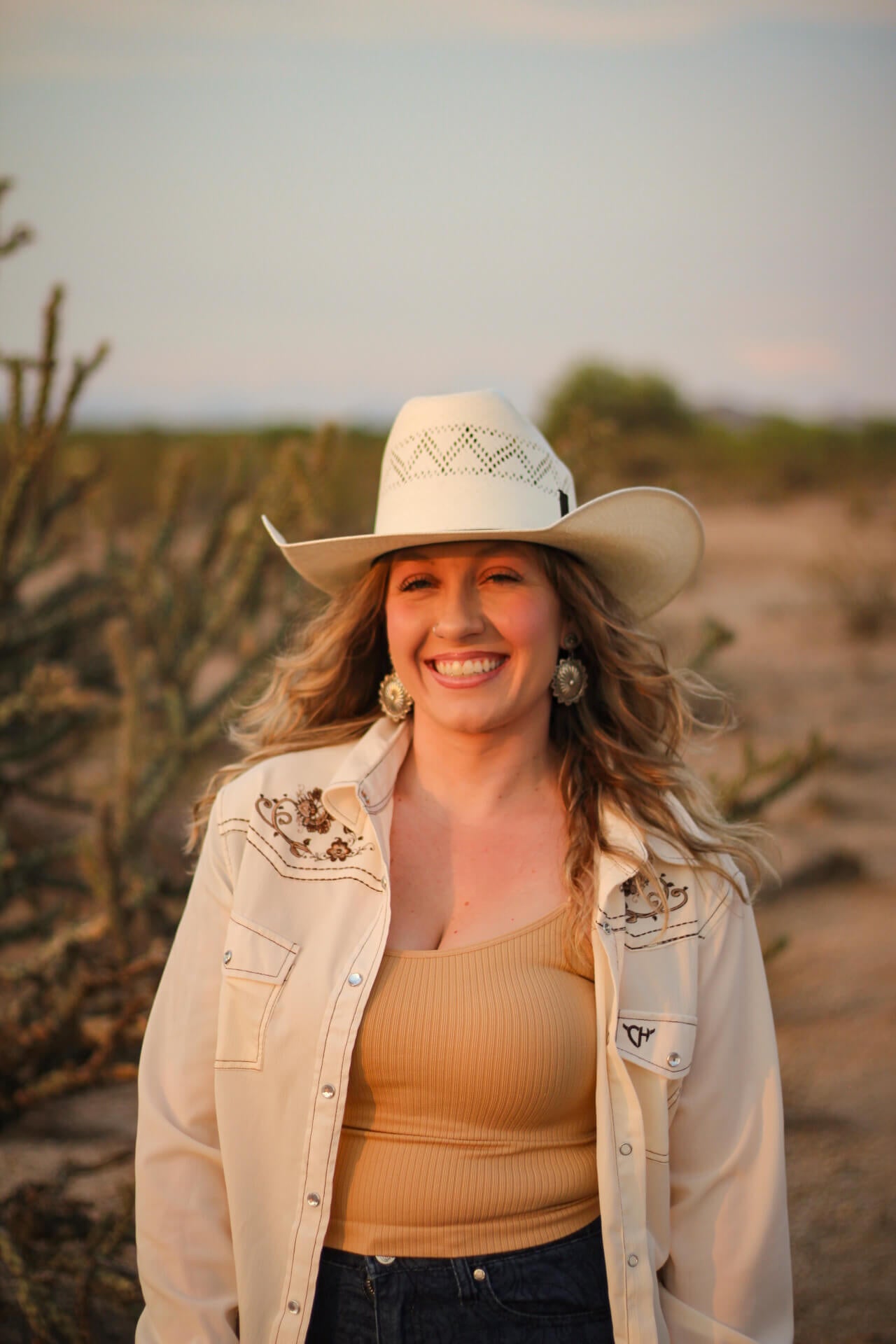 Cowgirl wearing a Women's Cowgirl Hardware Vintage Off-White Embroidered Long Sleeve Solid Western Shirt