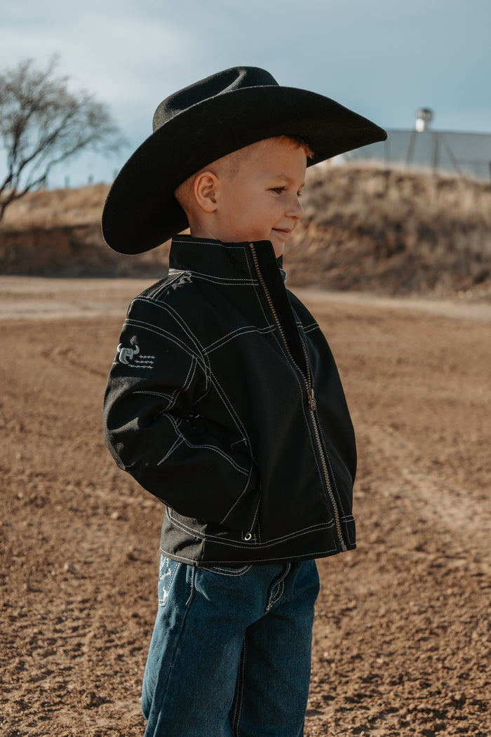Little cowboy supervising morning tasks.