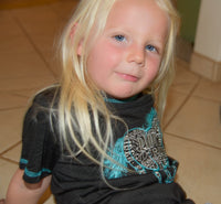 Young Cowgirl wearing CH "Ride Horse" Black Short Sleeve Shirt